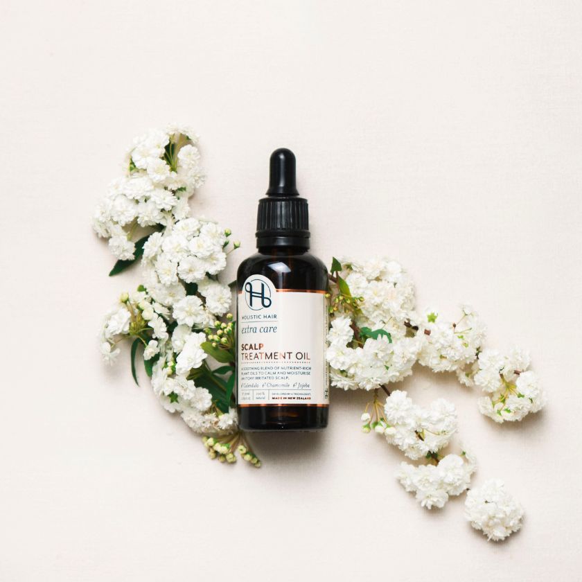 Scalp Treatment Oil on a botanical background.
