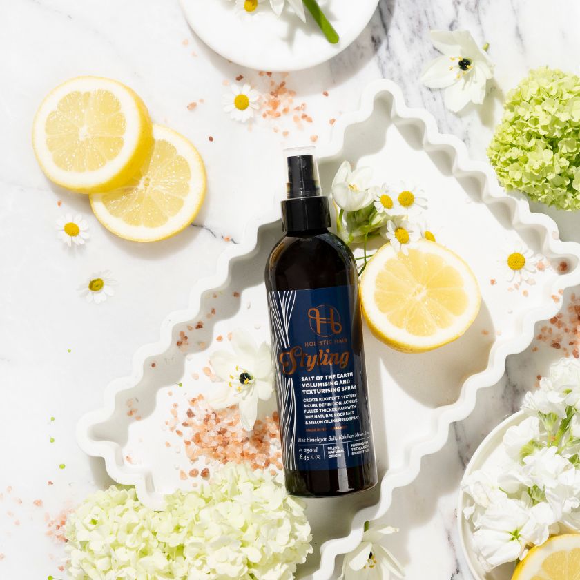 Image of Salt of the Earth Volumising & Texturising Spray on a botanical background.